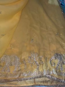 Elegant Yellow Saree with Elephant Motif