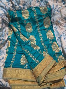 Elegant Teal Saree with Gold Floral