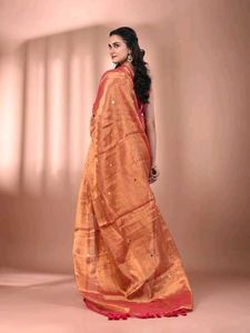 Vibrant Orange Tissue Saree with Pink Tassels