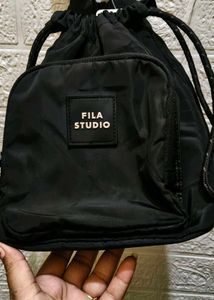 FILA STUDIO Drawstring Sling Bag