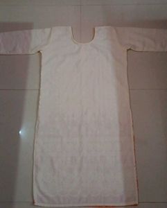 Elegant White Kurta with Orange Leaf Print
