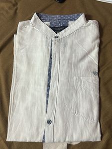 White shirt, with blue prints.