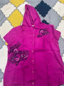 pink sleeveless shirt with cap