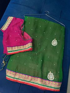 Elegant Heavy Green And Pink Embellished Saree