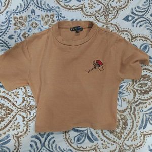 Tan crop top with rose Size M