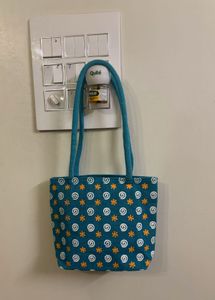 Teal Handbag with Swirl Pattern