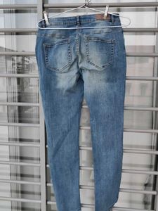Distressed Blue Denim Jeans
