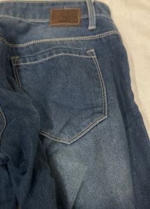 Distressed Blue Denim Jeans