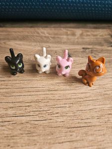 4 adorable cat figurines.