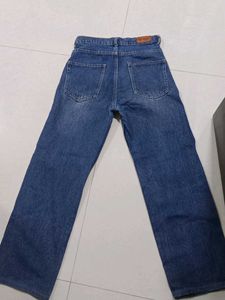 Ripped Knee Blue Jeans