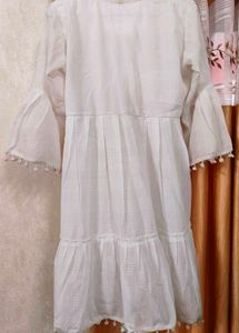 Elegant White Tiered Kurta with Pom-Pom Trim