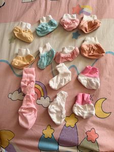 baby mittens,caps, and socks. 7 pairs