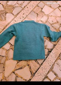 27. Crocheted Granny Square Sweater
