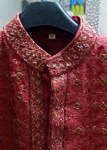 SHERWANI 36 SIZE RED COLOUR WITH HEAVY WORK IN IT FOR GRAND FUNCTIONS AND PARTIES READY TO USE CONDITION