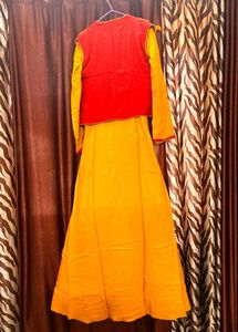 long yellow gown with red embroidered jacket