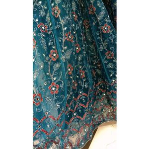 Elegant Teal Blue Party Wear Net Gown with Heavy S