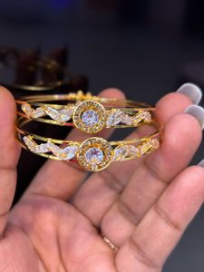 Elegant Gold Tone Bangles with Crystal Accents