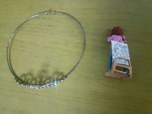 Sparkling crown and artist barbie figurine