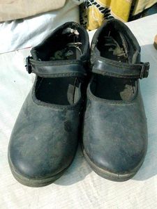 Worn Black Flats