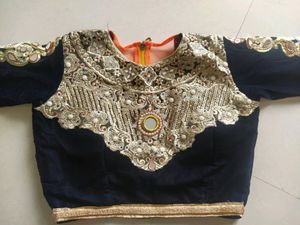 Velvet blouse with net dupatta and lahenga.    nav