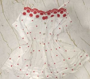 White top with red embroidery