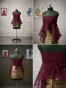 Exquisite Maroon Peplum top with golden mini skirt