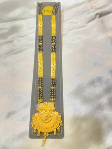 Elegant Gold Necklace with Black Beads