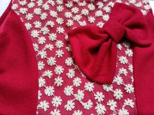 Free Delivery red dress with lace and bow detail.