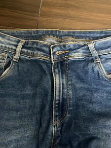 Distressed Blue Denim Jeans
