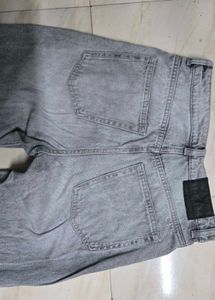 Grey baggy and bootcut jeans