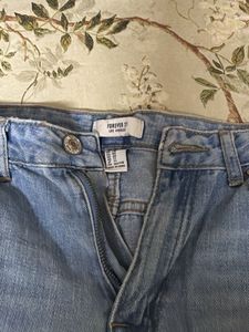 Distressed Light Wash Denim Jeans