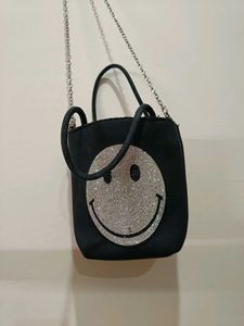 Rhinestone studded smiley face crossbody bag