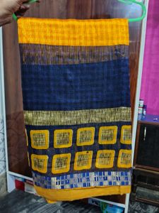 Yellow printed saree with stiched blouse ...