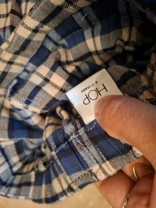 Plaid Pleated Skirt with Buckle Detail