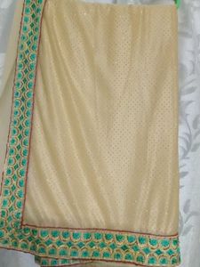 Elegant Beige Saree with Teal Border