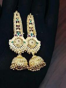 Gold Jhumka Earrings with Green Stones