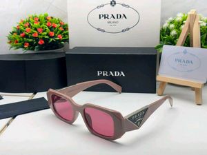 Prada Sunglasses - Chic Pink Tinted Lenses