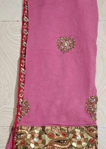 Elegant Pink Saree with Intricate Embellishments