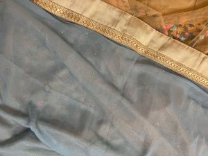 Powder blue floral net saree