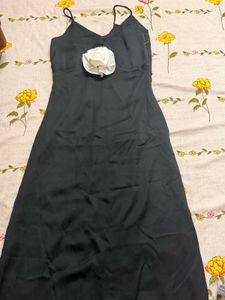Elegant Black Dress with Floral Accent