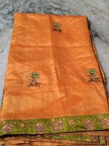 Elegant Orange Saree with Floral Print