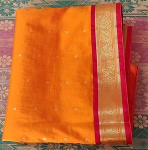 Vibrant Orange Saree with Gold Border