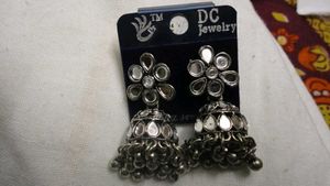 jhumkas and one peacock festive earring