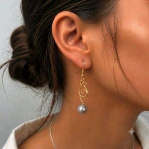 Elegant Gold Swirl Pearl Drop Earrings