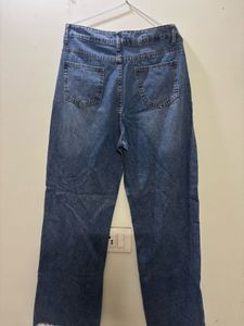 Distressed Blue Denim Jeans