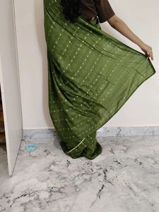 Elegant Green Saree with Gold Accents