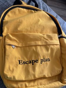 Yellow Backpack with "Escape plan" Text