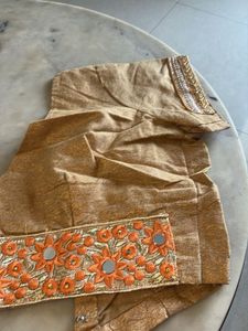 Elegant Orange Saree with Intricate Border