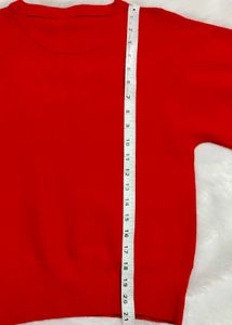 red woolen top