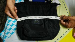 FILA STUDIO Drawstring Sling Bag